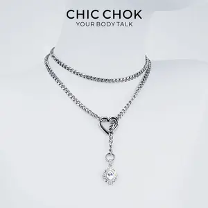 Golden Silence Luxe Necklace - Gold chain with heart-shaped pendant, red gemstone and multi-layered links