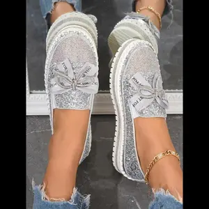 Women’s fashionable slip-on loafers decorated with glitter sequins—lightweight, breathable shoes that are perfect for holiday essentials; trendy footwear.