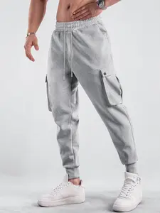 Unisex loose jogger sweatpants — featuring a large 3D pocket and drawstring waistband; versatile, trendy joggers for sports and casual wear.