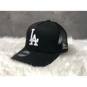 Los Angeles Dodgers New Era 9FORTY Snapback Baseball Cap – Black, flat brim, white LA logo and commemorative badge on the side, MLB streetwear accessory.