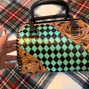 Harlequin Pattern Handbag with Intricate Floral Embroidery and Secure Buckle Closure speedy