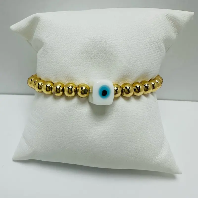 Gold laminated elastic bracelet with evil eye. Chic & Sophisticated Design for Casual & Formal Occasions - Comfortable Wear - Versatile Jewelry Accessory