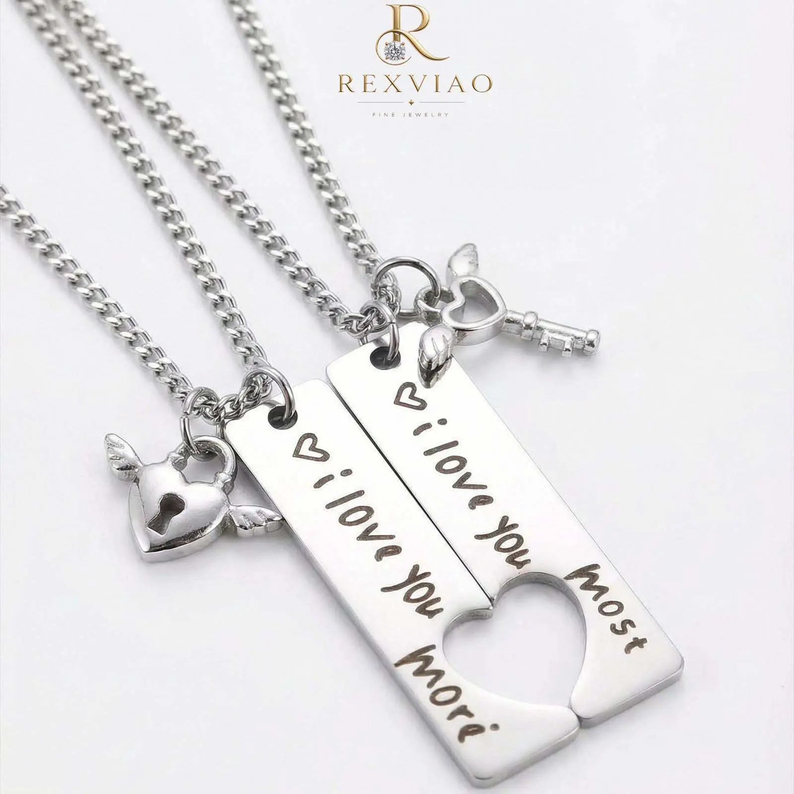 Rexviao Rectangular Couples’ Necklace Set: “I Love You More” engraved pendant with cutout half-heart design | Includes small heart-and-wing pendant | High-quality titanium steel | Ideal anniversary gift for girlfriend