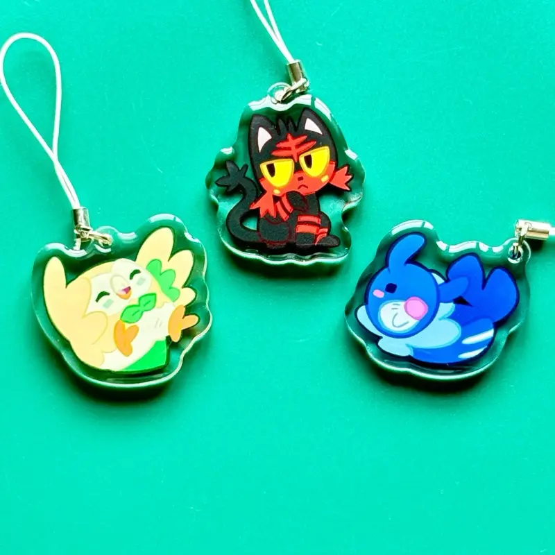 Pokémon Collectible Keychains - 1.5in Compact and Stylish Acrylic Key Accessories, Double-Sided Epoxy Coated, Generation 7 Starter Characters Including Popplio