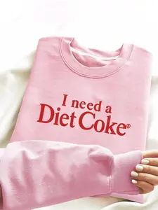 This crewneck sweatshirt features the words "I need a bottle of Diet Coke" printed on it. Made of comfortable fleece fabric with a pleasant texture, it's perfect for everyday casual wear, ideal for winter school attire.
