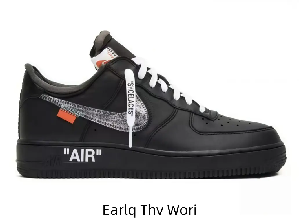 Classic low-top leather sport sneakers featuring transparent side logo and small orange tag, sleek black upper suits men and women all year round.