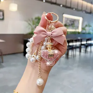 Coquette Bow Keychain, Creative Water Bottle & Perfume Bottle Bag Charm, Exquisite Pearl Chain-Attached Keychain Charm, Fashionable Car Key Ring Gift Accessory, Bag Charm Keychains, Chain-Attached Keychains