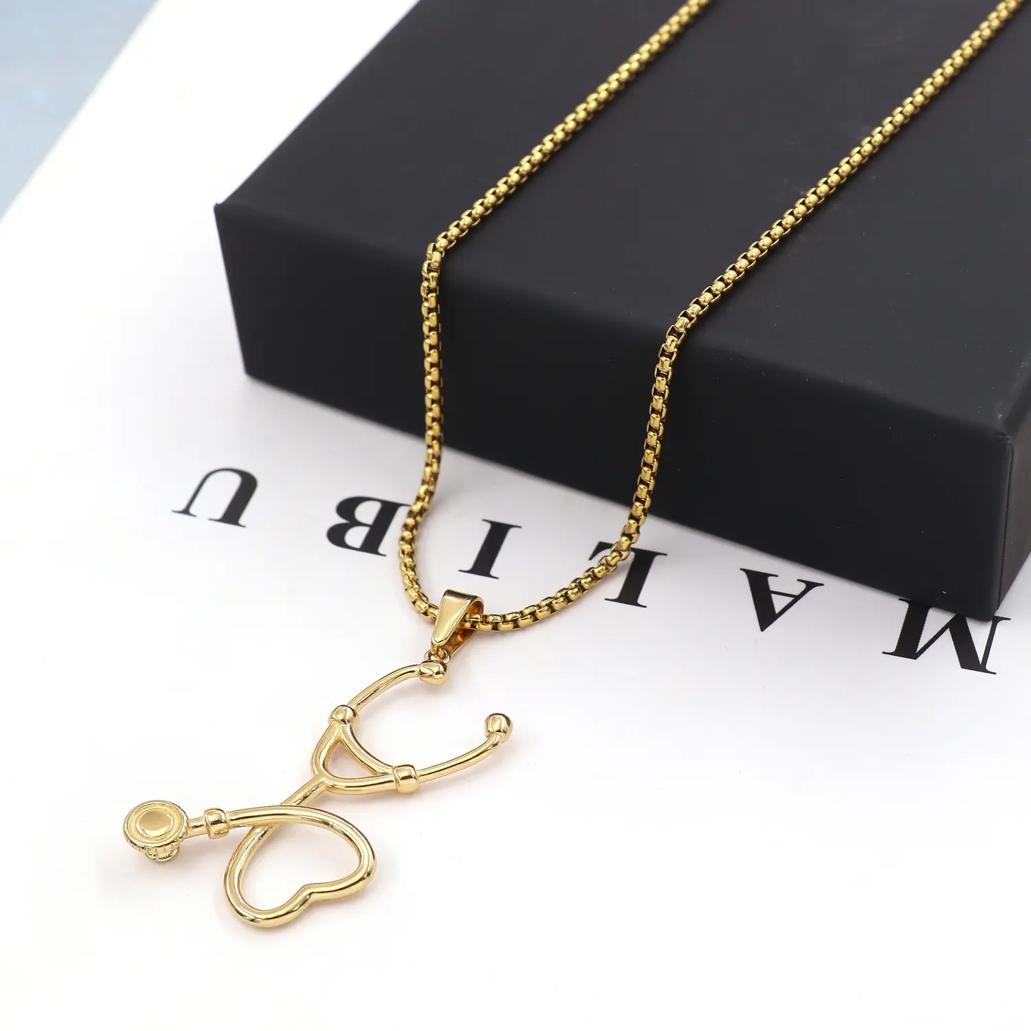 Stainless steel heart stethoscope necklace in gold tone or silver tone, waterproof, hypoallergenic, colorfast; comes with a box and chain—an elegant commuter accessory.