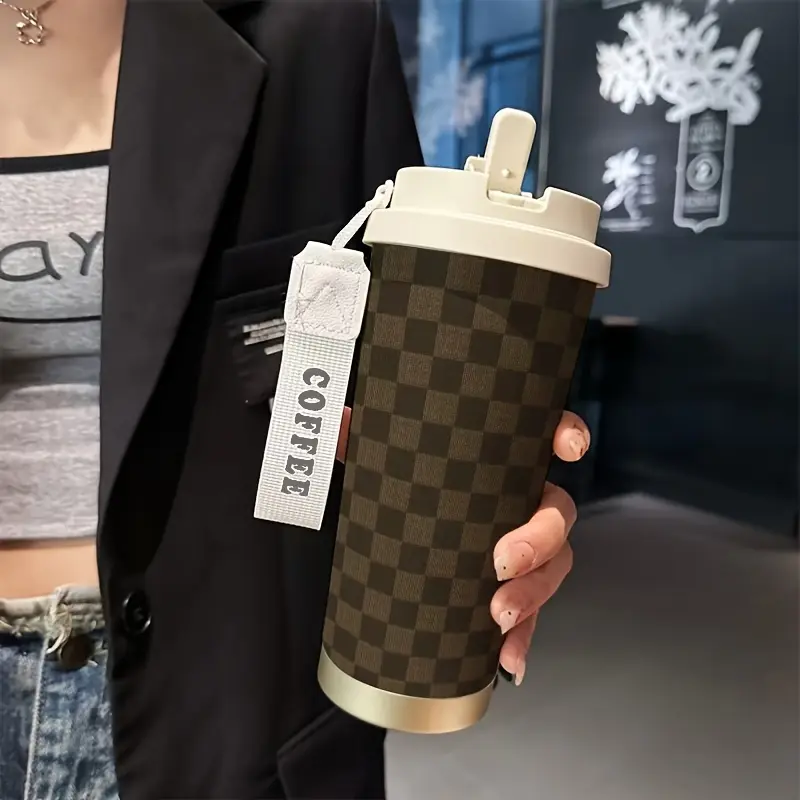 1 18-ounce stainless steel insulated travel mug.Brown plaid print.Comes with a handle strap.Includes a straw.Outdoor mug.Travel mug.Coffee mug.Birthday gift.Christmas gift.Halloween gift