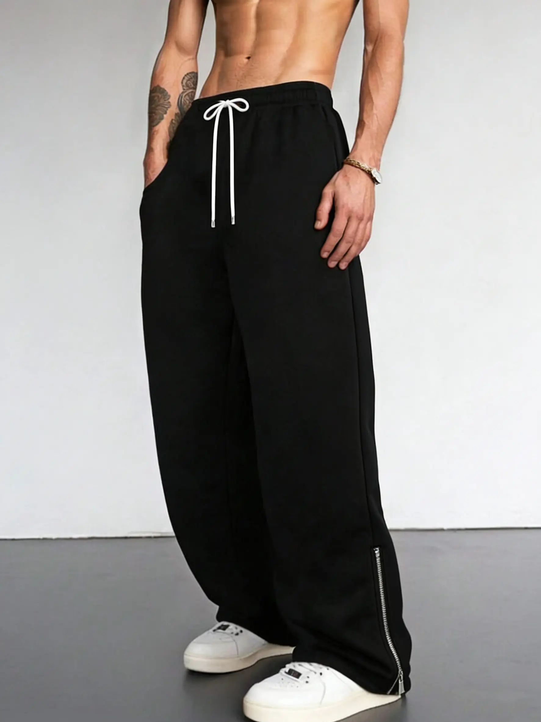 Men’s autumn loose straight casual pants featuring a zipper at the hem for a fashionable, trendy look.