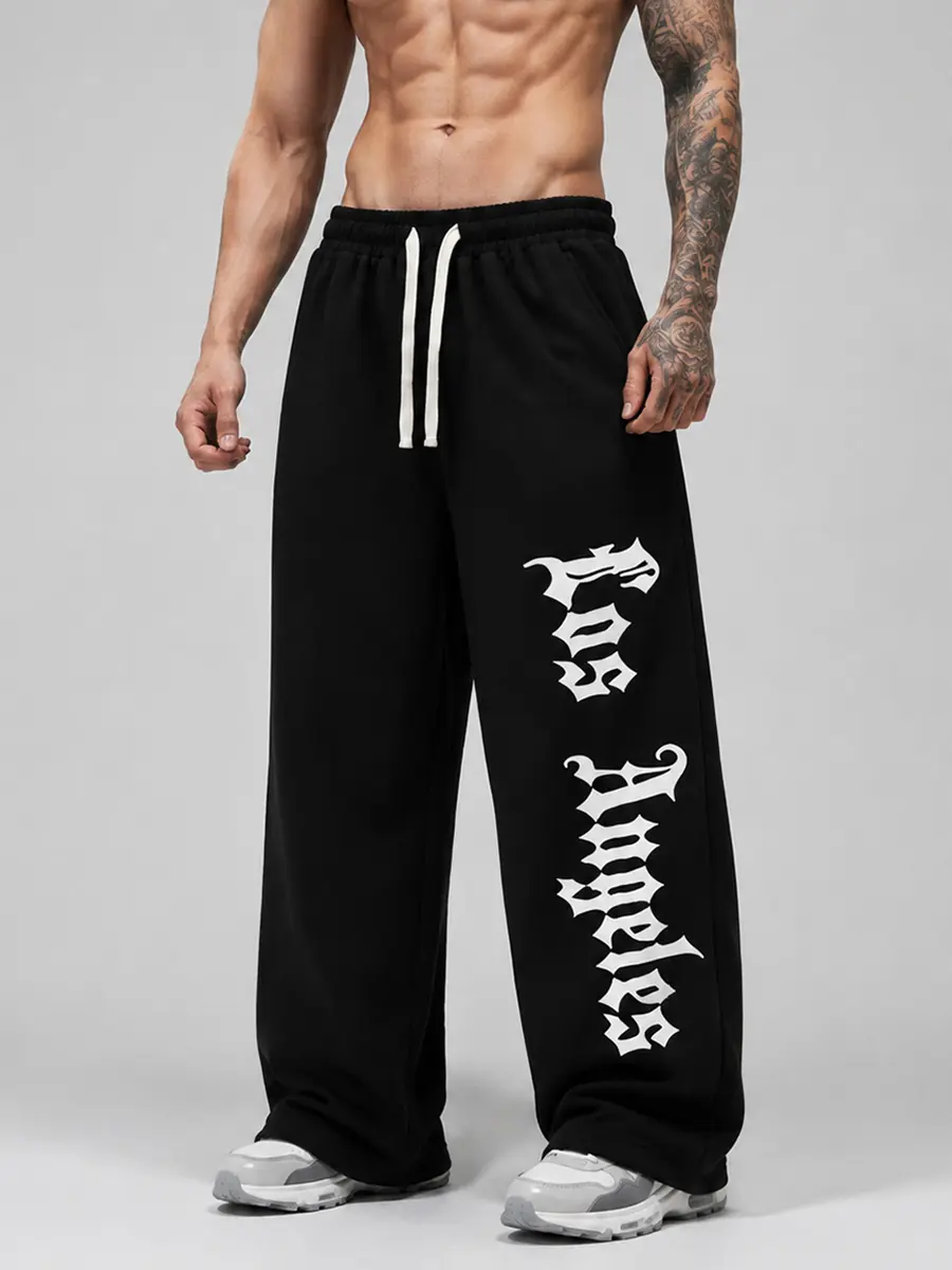 Men’s black gothic letter graphic baggy sweatpants, oversized wide-leg y2k streetwear joggers with drawstring waist, casual hip hop pants