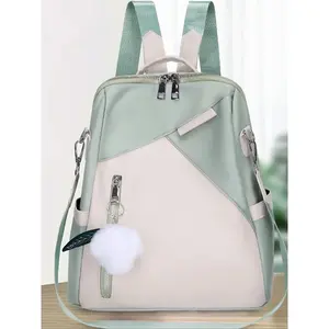 Light pink and light green contrasting backpack, niche simple and fresh style plush pendant, trendy travel backpack, fashionable commuting shopping backpack, lightweight daily travel bag