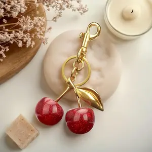 Cherry keychain bag decoration - golden tone - red shiny cherries - suitable for handbags - multi-functional and fun