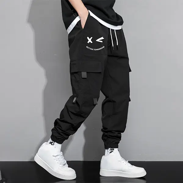 Men’s drawstring-waist pants featuring cartoon face and letter print; casual regular fit, practical athletic trousers suitable for all seasons; men’s long pants with a casual street style.