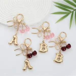 Trendy Cherry Bow Initial Keychain, Gold Plated Letter Pendant with Glitter Cherry Charm, Cute Bag Accessory for Backpacks, Handbags & Car Keys, Perfect for Students&Women