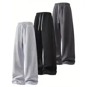 Men's 100% polyester loose-fitting sweatpants, drawstring elastic waistband, wide cut, casual everyday wear, spring style