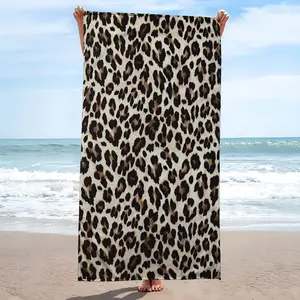 A superfine fiber beach towel with a leopard print pattern, featuring strong water absorption. It is very suitable for travel, swimming, diving, surfing, yoga, and camping, and can be used in all seasons.