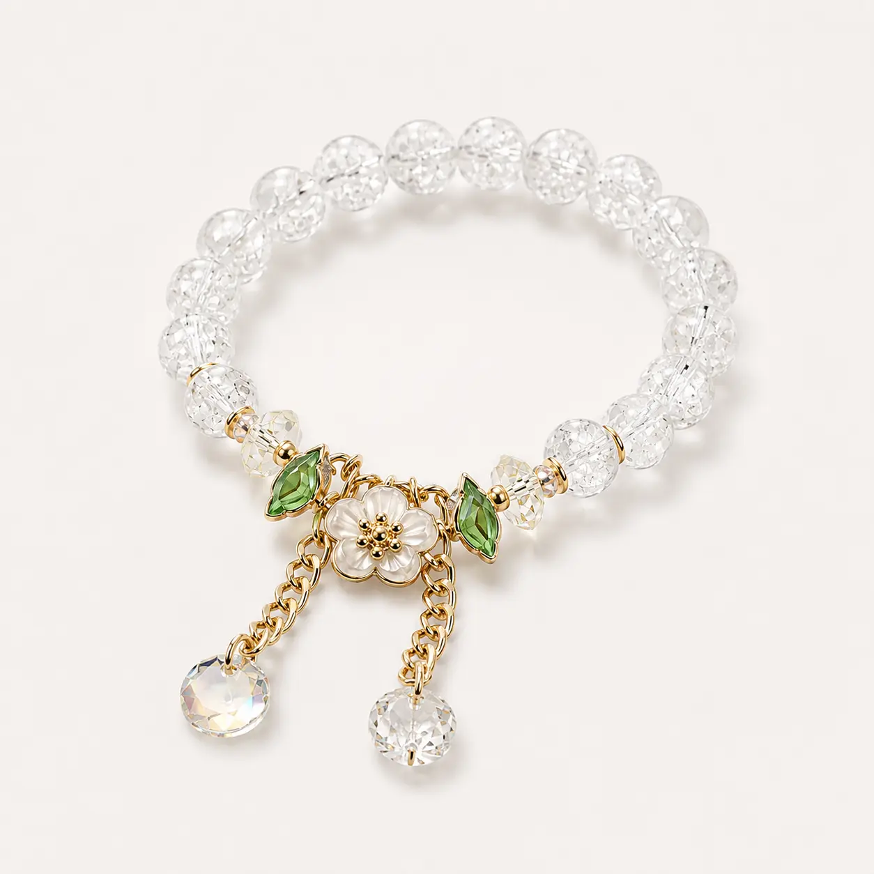 Women’s Clear Crackle Beaded Stretch Bracelet with White Flower Charm, Green Leaf Accents and Gold-Tone Crystal Dangle Tassels, Elegant Floral Jewelry Gift