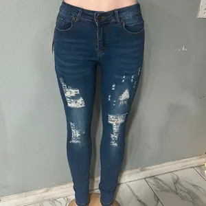 Women's Distressed Skinny Jeans - Blue Denim with Ripped Details for Casual Wear
