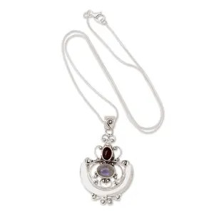 NOVICA Rainbow Moonstone and Garnet Necklace for Women, Artisan Handmade Indonesian Sterling Silver Pendant, Balinese Arabesque Jewelry, 17.25 Inches Long, 1.8 Inches x 1.1 Inches Birthstone Charm