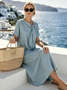A fashionable French loose bow dress for women's summer beach vacation, lazy and windproof, slimming and long skirt, suitable for beach vacation, banquet, party, shopping, dating, honeymoon travel, ancient town cultural tourism check-in