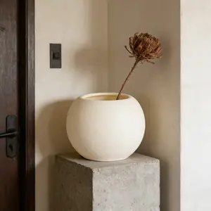 White spherical weather-resistant flower pot for indoor/outdoor use. Ideal for succulents, ferns, snake plants. Perfect for home, office, or garden. Lightweight, easy to clean, a great gift for plant lovers.