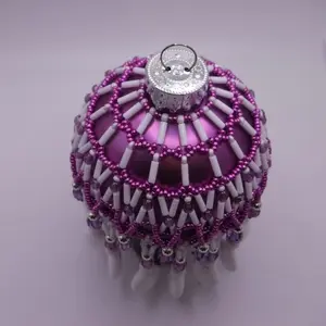 Handmade beaded ornament, purple and white