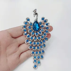 Luxurious Peacock-Inspired Brooch Pin - Dazzling Rhinestone Embellished, Versatile Zinc Alloy Design for Daily and Special Events, Elegant Accent for Dresses, Coats, and Scarves with Tassel Details