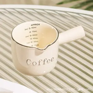 Stylish coffee creamer pitcher with measuring marks, espresso extraction cup, exquisite ceramic measuring cup and milk jug.