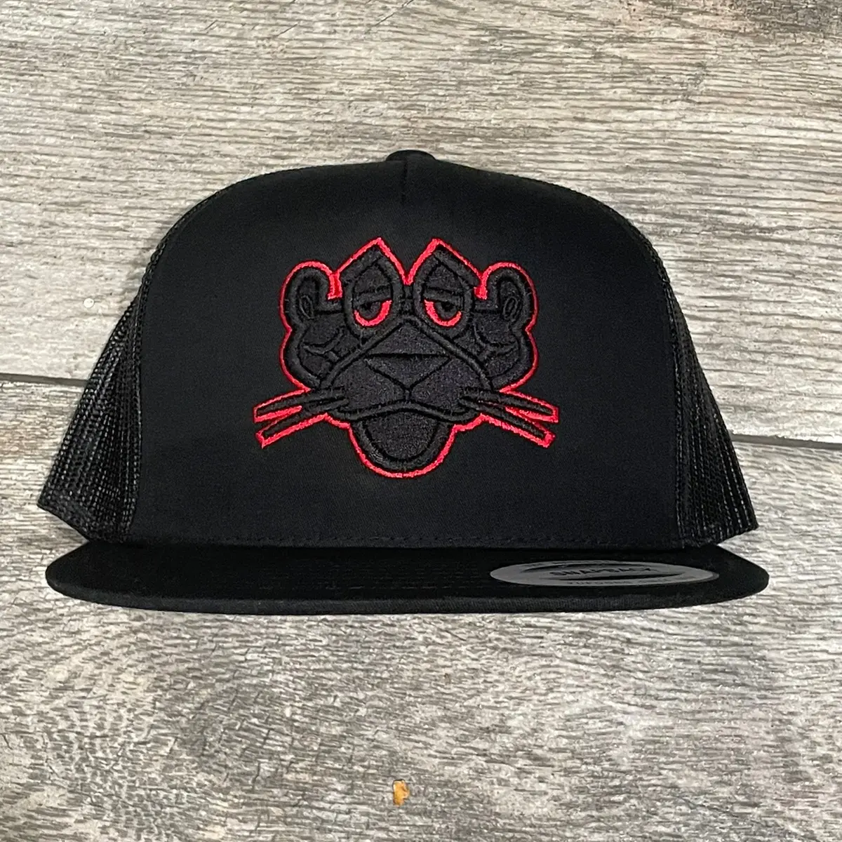 Panther Metallic Red Puff Embroidery Trucker Hat.
