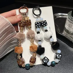 [Lianwang] Autumn and winter mobile phone chain belt hairball Maillard brown leopard print lanyard crystal wrist heavy industry temperament chain light luxury high-end pendant bracelet plush wristband rope, Phone wrist strap, Phone accessories