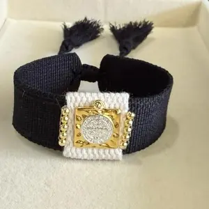 Handmade Black Religious Bracelet with Gold Accents and Tassel Detail for Spiritual Wear