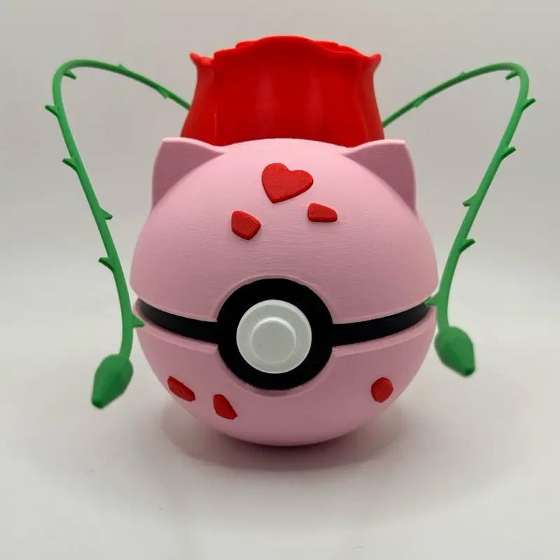 Fun Novelty Bulbasaur Themed Pokeball Collectible Figurine Statue - Pink Design, Red Cap, Green Arms, Heart Accents, Valentine's Day Ornament, The Card Guy TCGs Franchise Enthusiasts Gift, Decorative TV/Movie Character Piece