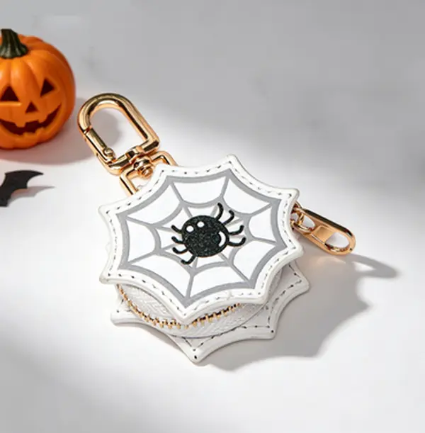 Portable Halloween mini keychain pouch with pumpkin & spider web patterns. Great for Halloween parties and daily carry to store earbuds, coins and lipsticks.