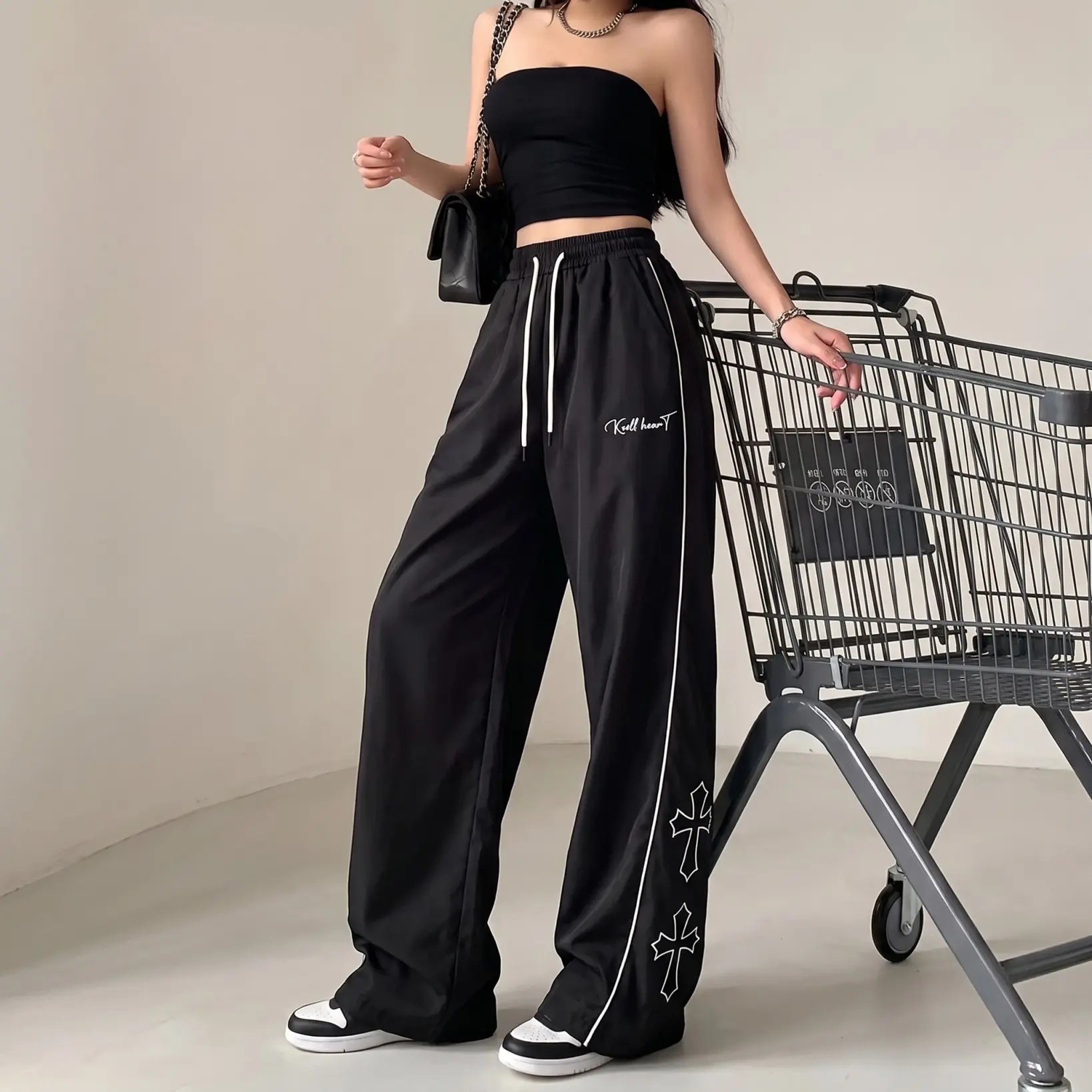 Women’s cross print wide-leg quick-dry athletic pants, elastic waistband with side stripes, loose casual sports trousers featuring a classic Gothic cross pattern. Lightweight, breathable quick-dry fabric that feels smooth and doesn’t feel stuffy—suitable