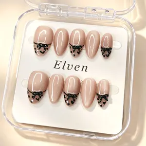 Elegant Nude Handmade Short Almond Press-On Nails Short Almond with Black Bow Design for Stylish Manicure