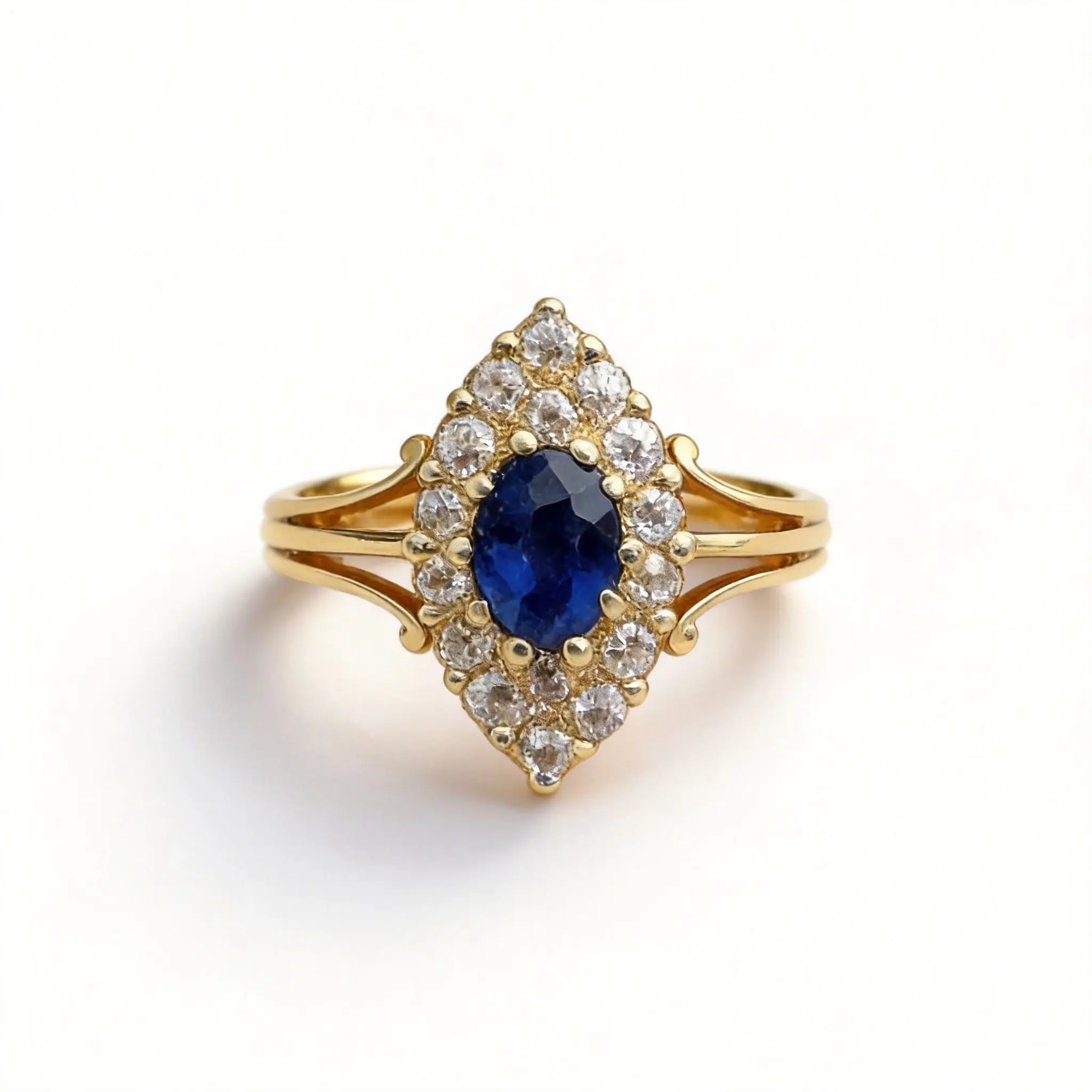 A vintage Victorian-style ring featuring a classic marquise-cut synthetic zirconia set in a bezel setting, with a soft, lustrous finish that exudes vintage elegance—a designer engagement ring.