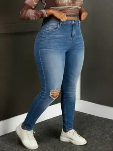 Plus-size women's high-elastic high-waist fashionable ripped slim-fit denim jeans with skinny legs. Stylish and slim, suitable for wearing in all seasons and comfortable to wear all day long