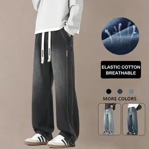 Men’s vintage washed wide-leg jeans with an elastic waistband and drawstring for a no-restrictive fit, breathable stretch cotton fabric, side seam stitching with leather tag details, loose fit that flatters all body types—a versatile streetwear piece for