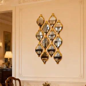 12-piece DIY gold teardrop decorative mirror set, made of polypropylene, artistic wall-mounted mirror, suitable for living room, bathroom, and entryway background wall decoration. Creative home gift.