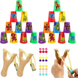 Dinosaur Sling Shot Game for Kids - 2 Wooden Slingshots,24 Cups & 30 Pom Poms,Carnival Toss Games Indoor Activities,Birthday Decorations