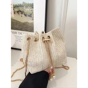 2026 small fashionable solid color hollow woven chain drawstring mini crossbody bucket bag, multifunctional design, suitable for shopping and travel
