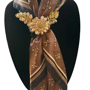 Brown Pashmina with figures in cheetah print with a brooch to adjust