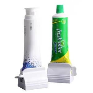 Portable roller toothpaste squeezer, universal toothpaste holder for bathroom vanities, non-slip and moisture-proof toothpaste organizer, a must-have two-piece toothpaste tube squeezer for lazy people.