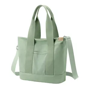 RIVERICH Large Canvas Tote Bag with Multiple Pockets - 2-in-1 Convertible Shoulder & Crossbody Bag for Women. This spacious organizational tote features multiple compartments, Perfect as a durable work bag, diaper bag alternative, travel carry-on tote