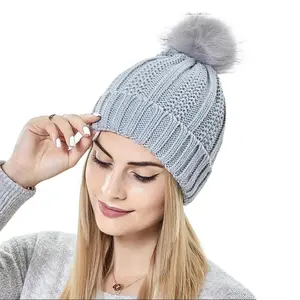 Women's Fashion Stretchy Satin Lined Skull Knit Beanie Hat with Faux Fur Pom Pom for Winter