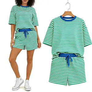 The new women's striped low-shoulder, versatile, loose, casual shorts set, featuring a cinched waist, is ideal for weekend brunches, dating, and casual outingsWomen's Striped Loungewear Set, Casual 2 Piece Outfits, Oversized Tee & Drawstring Shorts