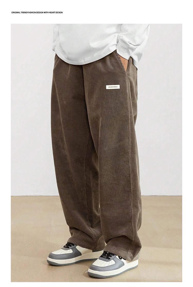 Men’s American vintage corduroy straight-leg pants—trendy, versatile brown casual long trousers with a drawstring waist and loose fit; simple, stylish men’s bottoms suitable for everyday wear and sports.