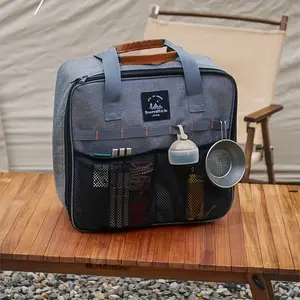 Large capacity gray camping storage bag with multiple compartments, durable fabric, handle, and mesh side pockets for cutlery, gas canisters, and essentials - portable outdoor storage box suitable for camping, hiking, and travel, camping eq