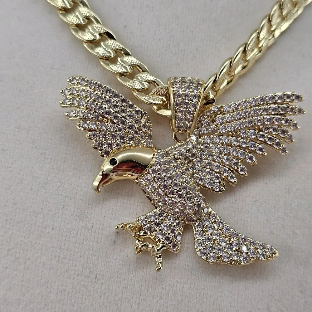 (104)  eagle pendant and cuban chain 24 inches 8mm  14k Gold plated.